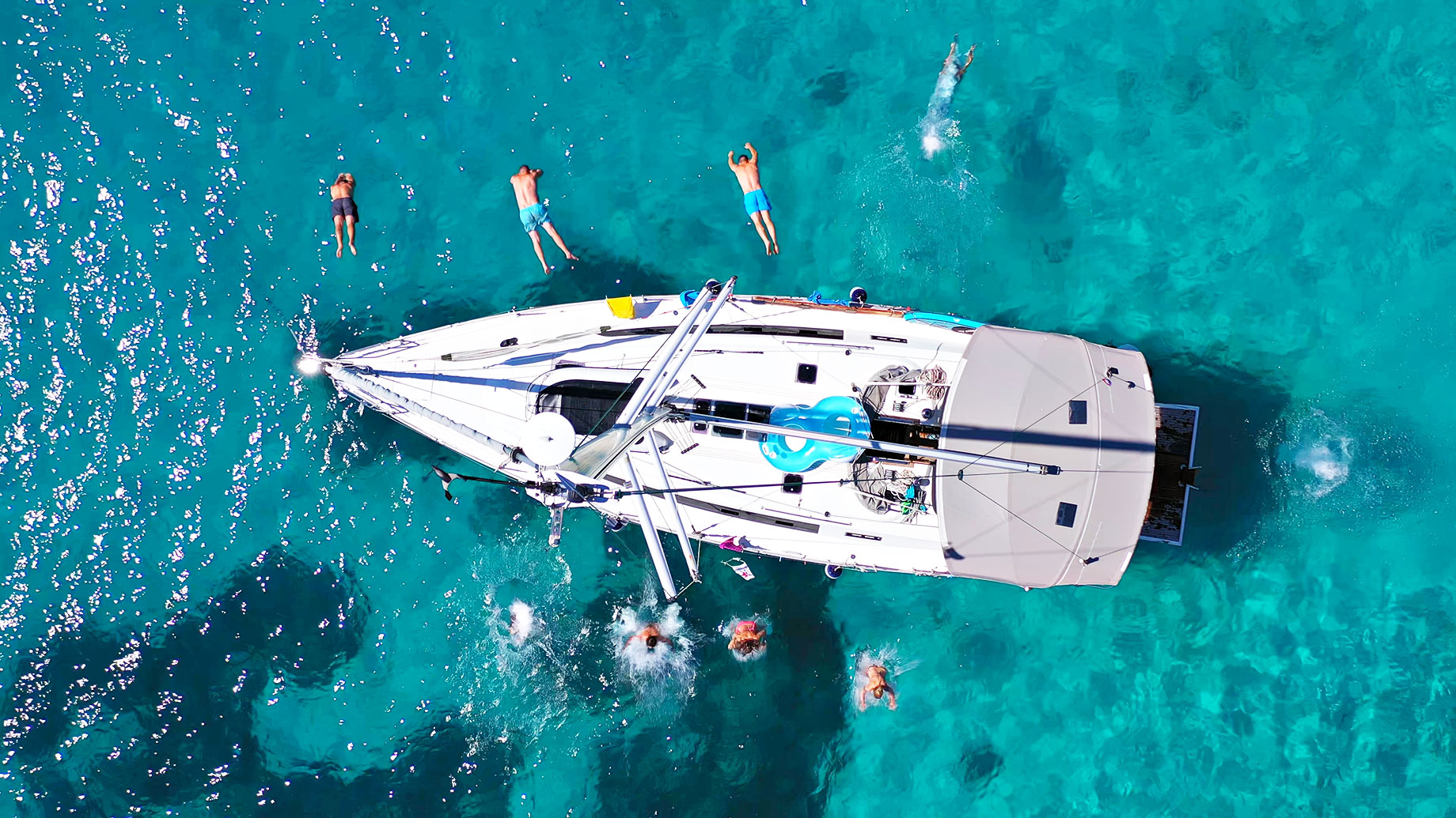 Jumping from a Sailboat Yacht from the Mediterranean Balearic Island of Ibiza, Spain
