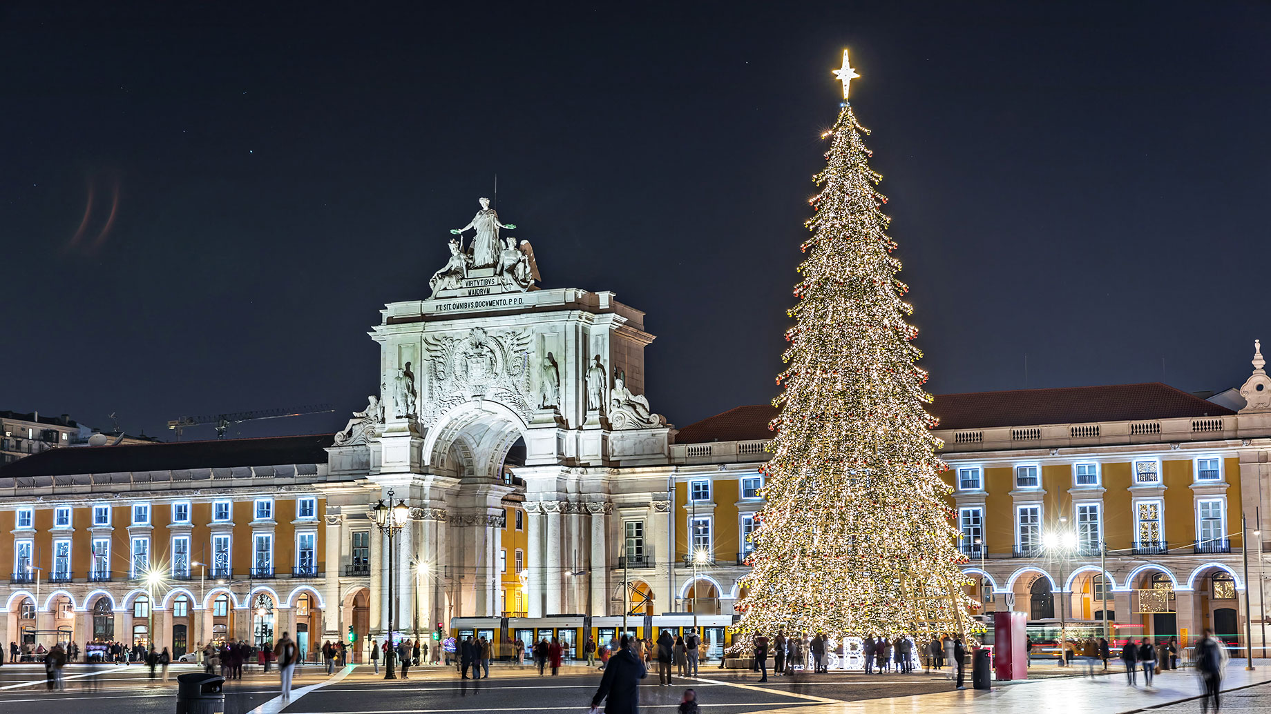 Commerce Square Illuminated with a Towering Christmas Tree in Lisbon, Portugal