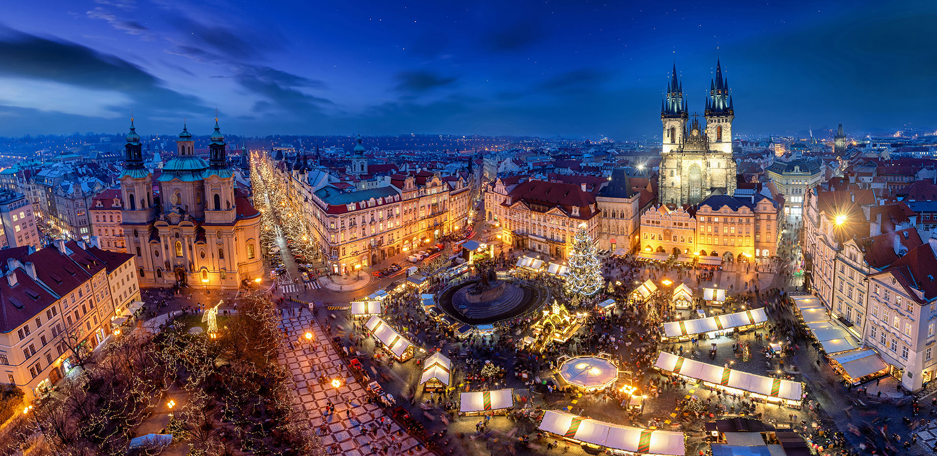 Panoramic View of a Traditional Christmas Market at Blue Hour in Prague, Czechia