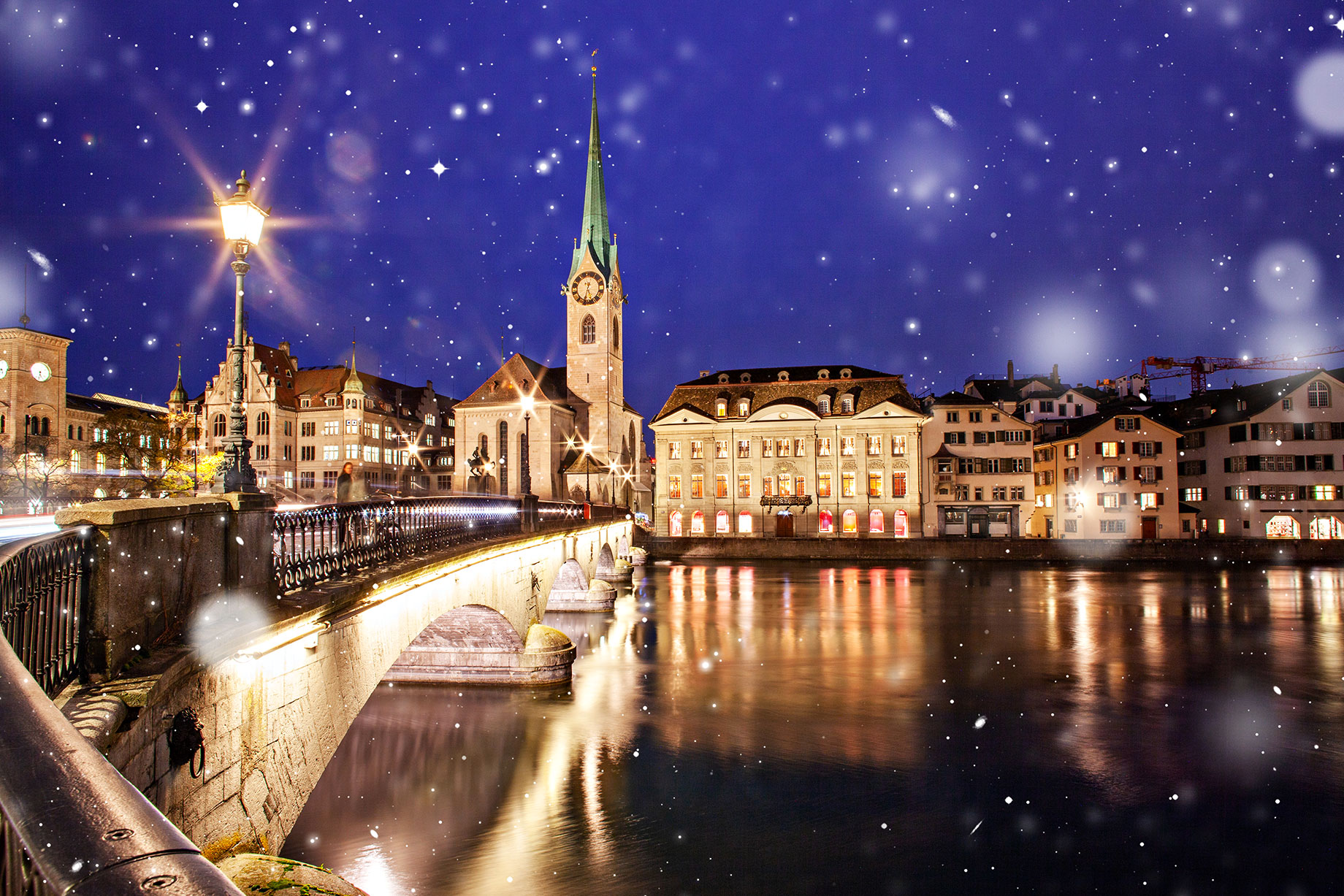 Snowfall in Zurich, Switzerland with a View of Fraumunster and Grossmunster Churches over River Limmat
