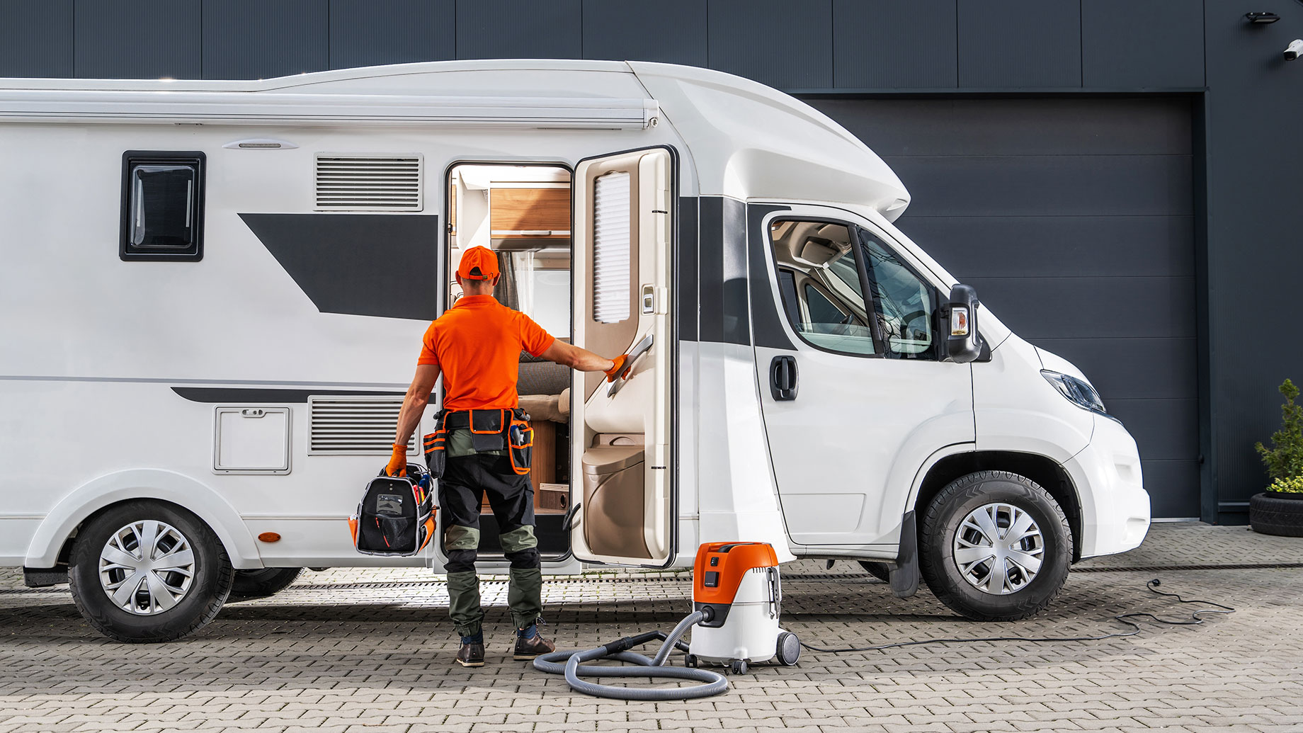 Motorhome RV Serviceman Performing Maintenance