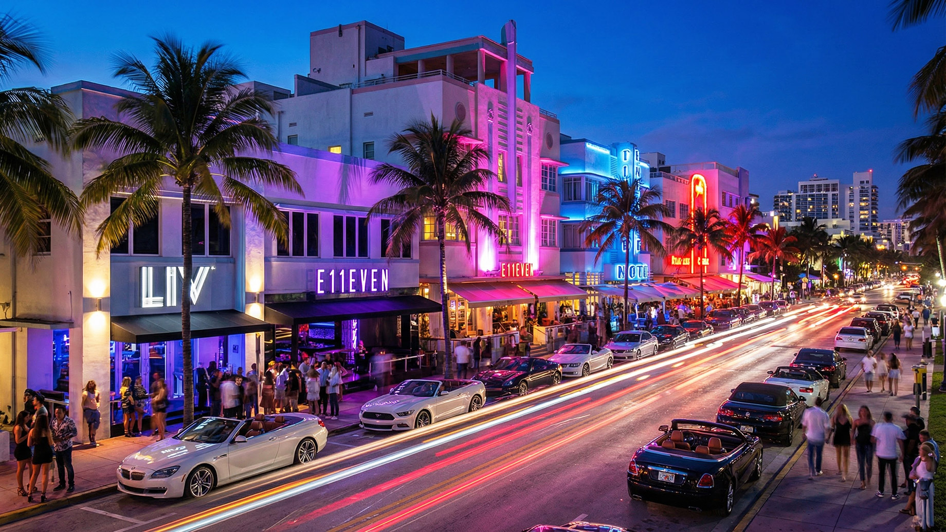 A vibrant Miami nightlife scene on Ocean Drive featuring neon-lit Art Deco architecture, swaying palm trees, and luxury cars, capturing the electric atmosphere of South Beach after dark.