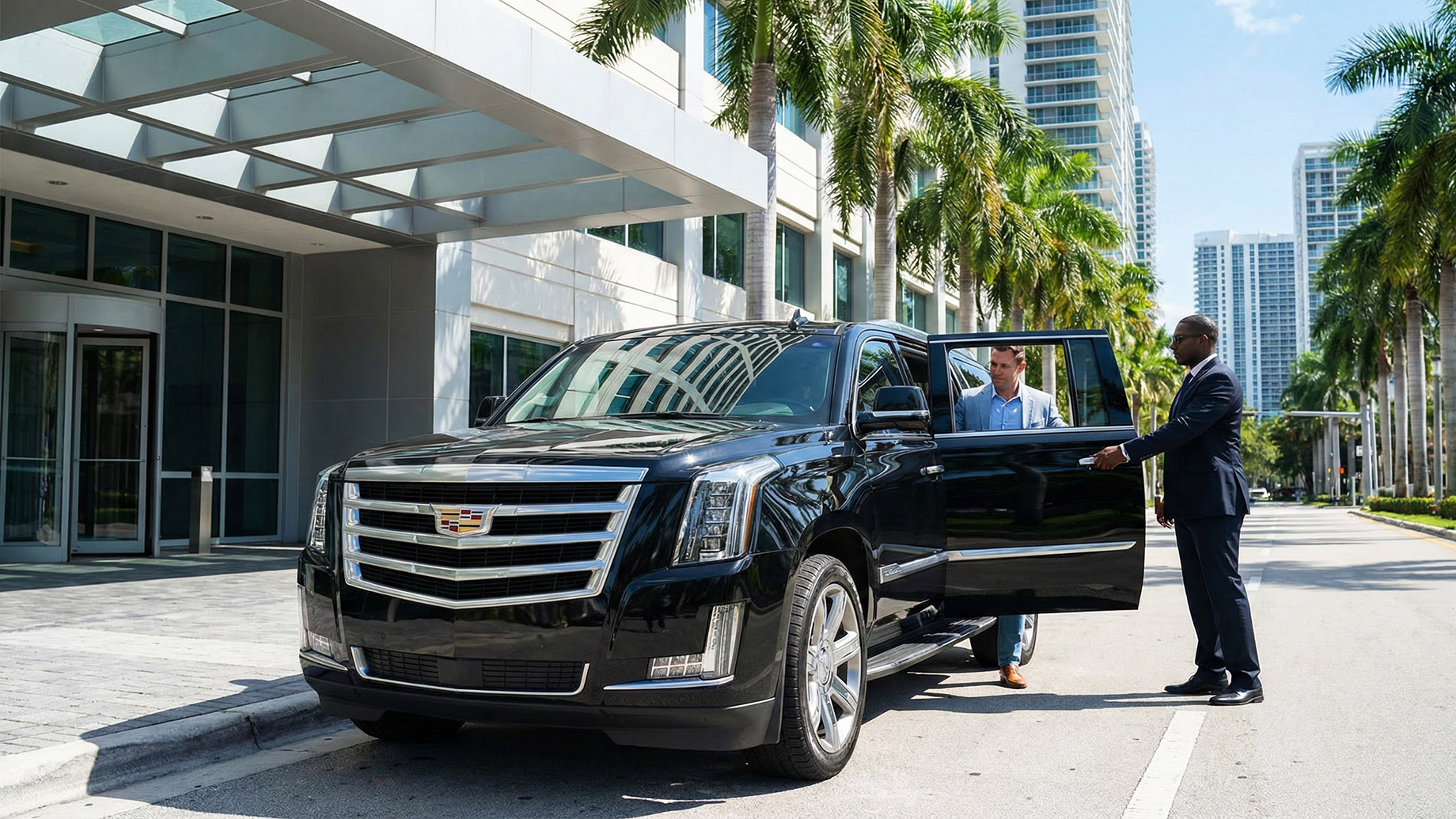 A professional chauffeur in a suit standing beside a sleek black luxury sedan on a city street, representing reliable executive limousine services for long-distance and metropolitan travel.