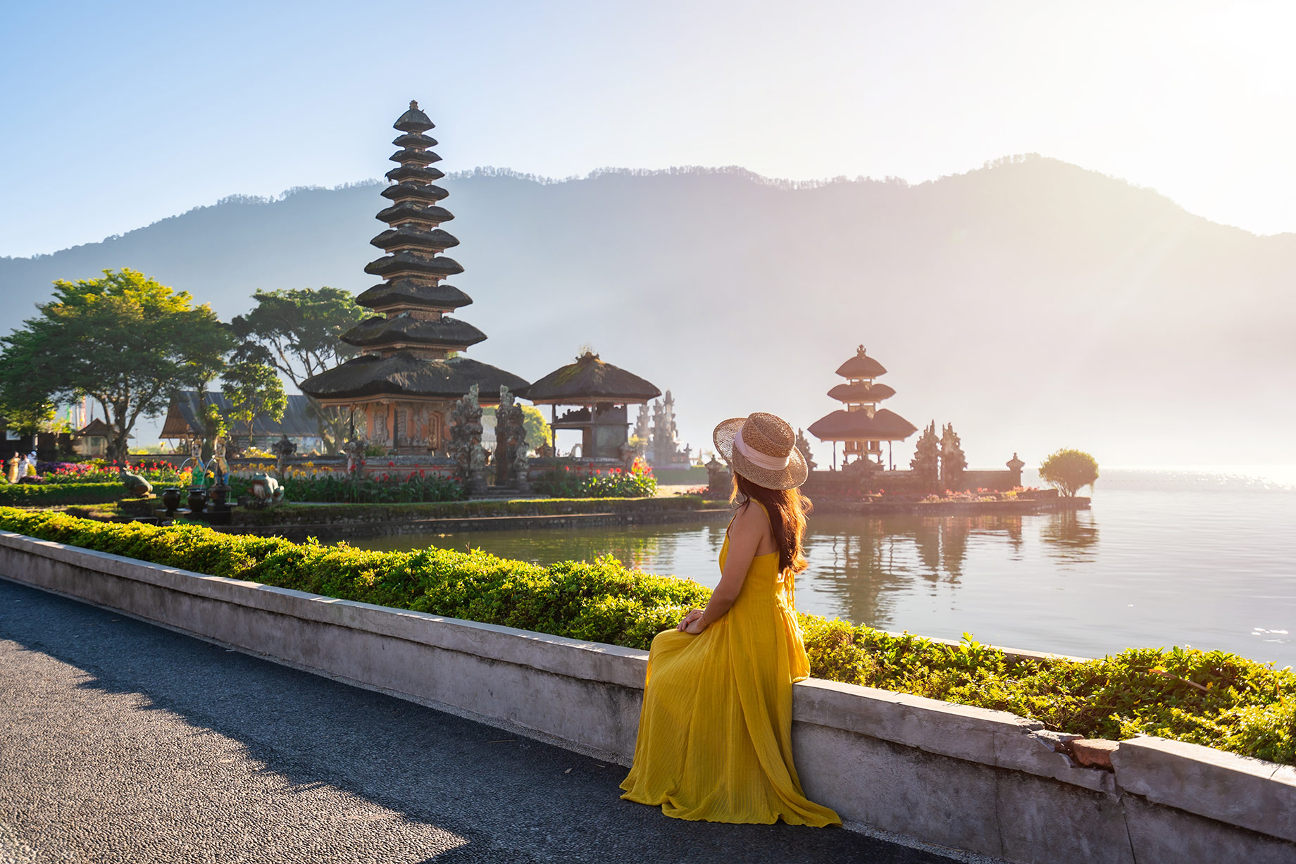 Female Tourist Enjoying the Views at Ulun Danu Beratan Temple in Bali, Indonesia